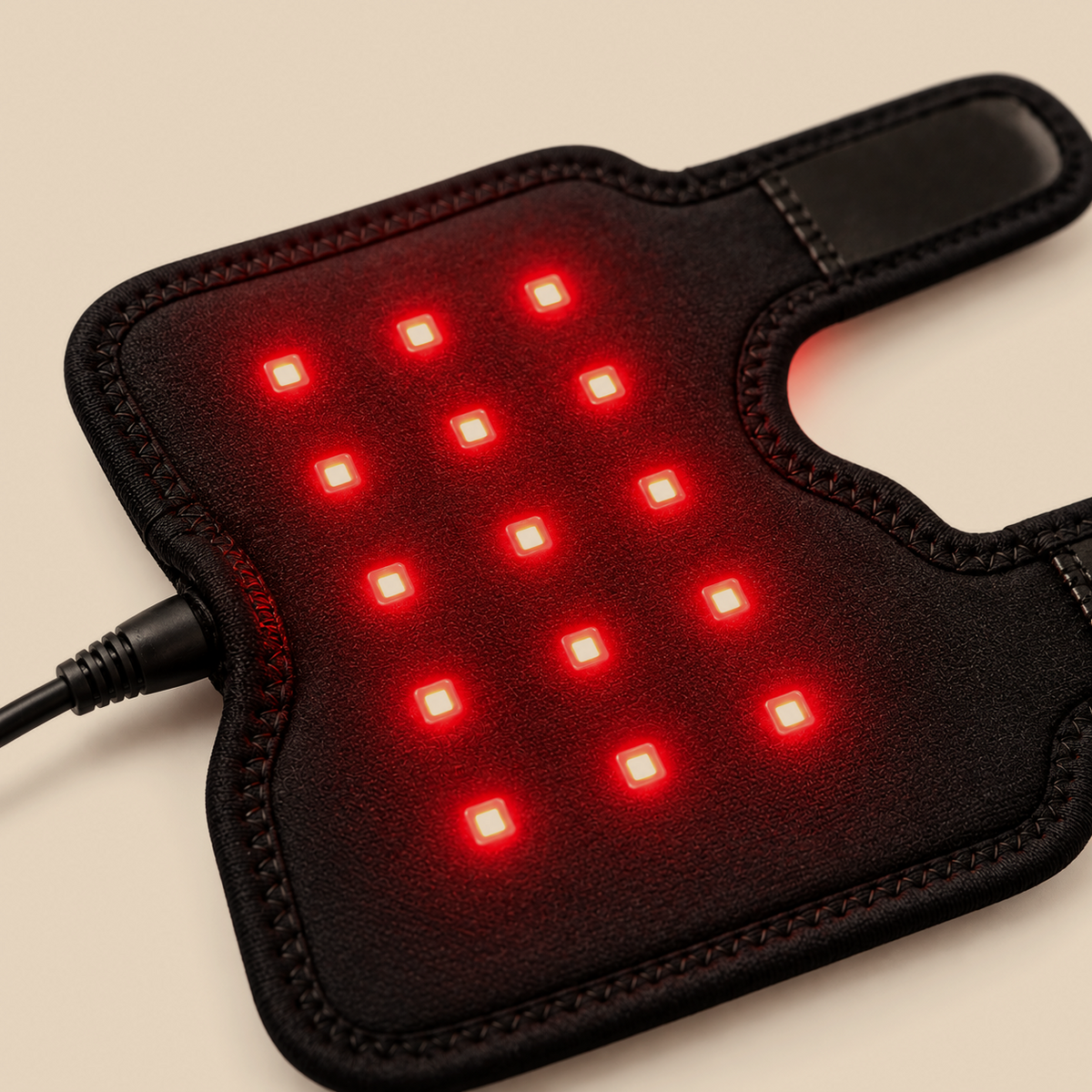 Glow Leg Pad close-up showing the red and near-infrared LEDs on the inner side